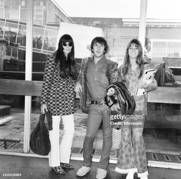 Sonny Bono & Cher pictured at London Heathrow Airport, with Cher's younger sister Georganne LaPiere, on their way to Amsterdam. 31st August 1966.