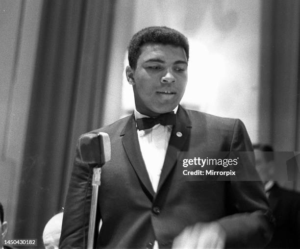 Cassius Clay attends a sports writers reception, on the day of his arrival in London. He is in England ahead of his next fight with Henry Cooper on...
