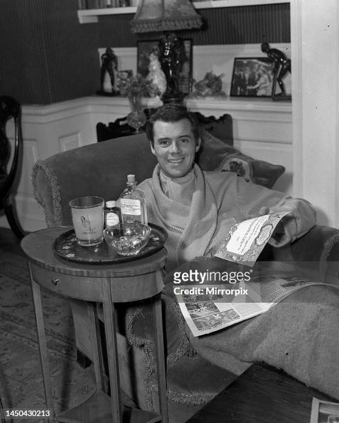 Actor Dirk Bogarde convalescing in his home at Amersham Common after an attack of jaundice. December 1955.