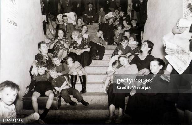 Families take cover from the Luftwaffe in a disused London Underground railway tunnel. September 1940.