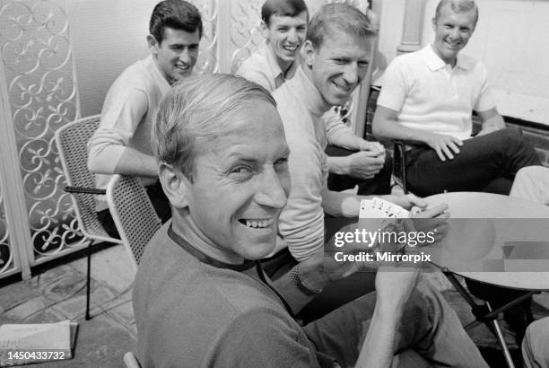 Bobby Charlton holds a full house in a game of cards with team mates Peter Bonetti, Martin Peters, Jack Charlton and Bobby Moore. 10th July 1966.