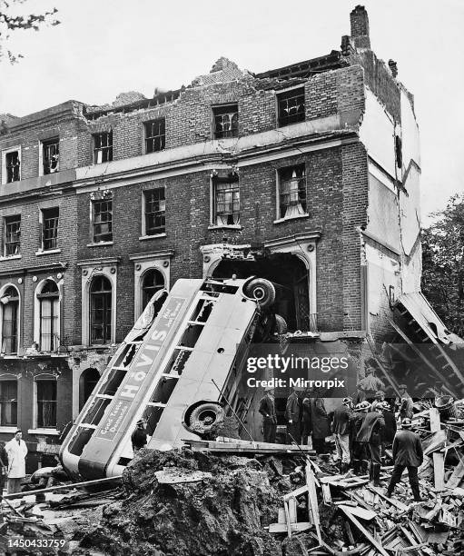 London double decker bus hit in an air raid leans against 34 Harrington Square Garden in North London. 9th September 1940.