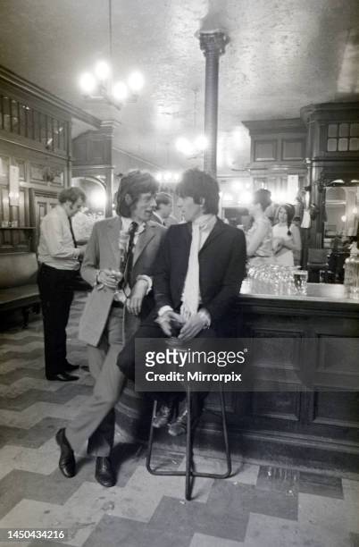 Keith Richards and Mick Jagger of The Rolling Stones. Enjoy drinks in The Feathers Pub, off Fleet Street, London, after being freed from prison on...