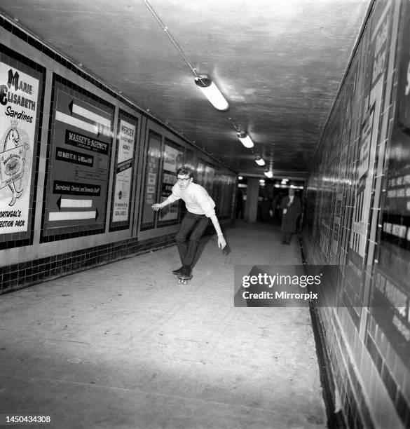 Music producer Andy Wickham rides on a Sidewalk surfer in London which he brought from America. March 1965.