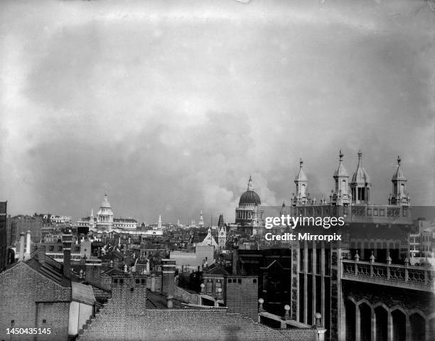 Smoke rises from behind the dome of St Pauls Cathedral after the first daylight bombing raid by the Luftwaffe on London.