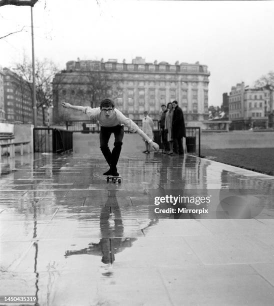 Music producer Andy Wickham rides on a Sidewalk surfer in London which he brought from America. March 1965.