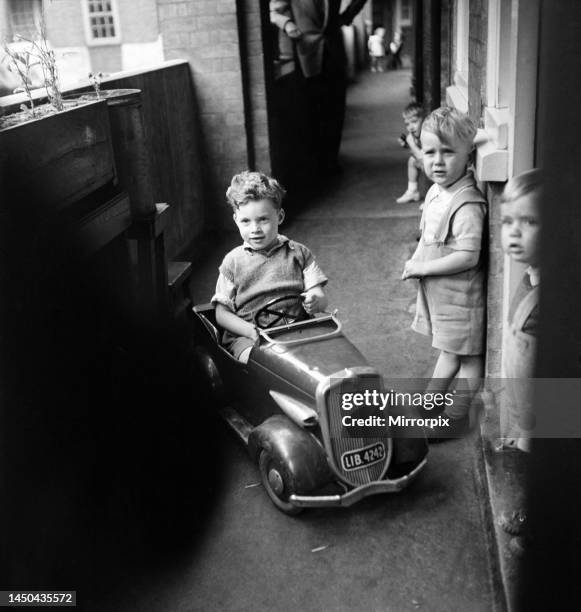 Father playing with his young son in Westminster, London. September 1950.