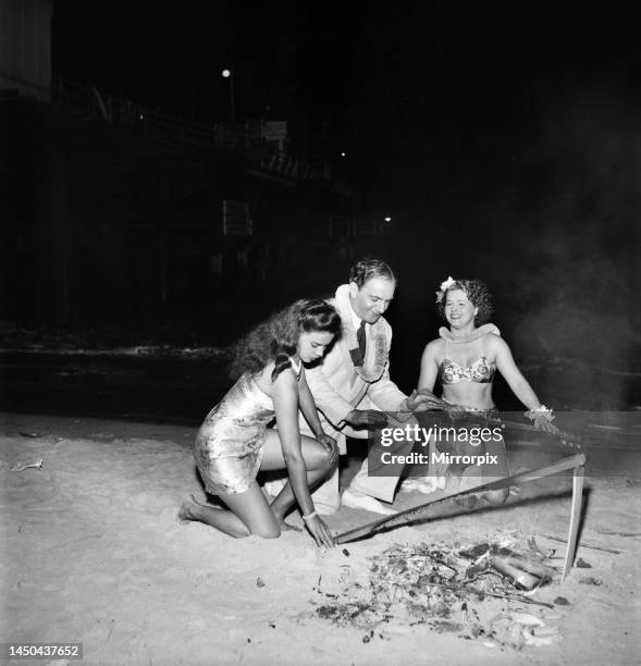 Felix Mendelssohn holds midnight beach party for Pulu Moe who has been with his band for 15 years. August 1950.