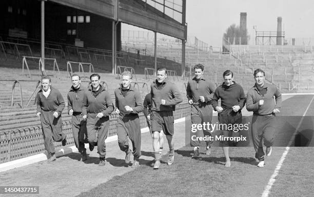 Arsenal Football Club Arsenal players train in front of the main east stand. Alex Forbes, Jimmy Logie, Reg Lewis, Leslie Compton, George Swindin and...