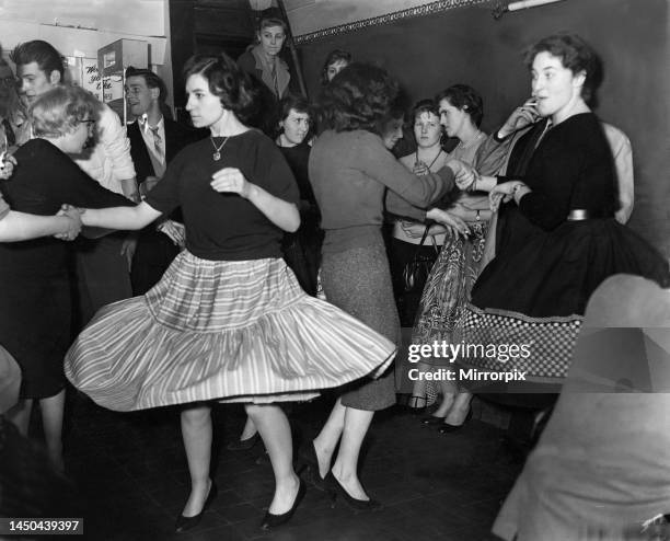 Couple enjoying rock 'n' roll dancing - Jiving at the Two 1s coffee bar in London.