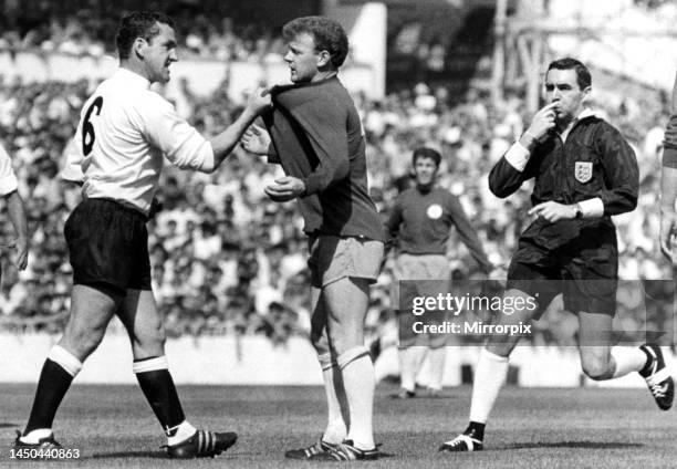 Dave Mackay grabs Billy Bremner of Leeds by his shirt in 1966 match Against Tottenham at White Hart Lane. 22nd August 1966.