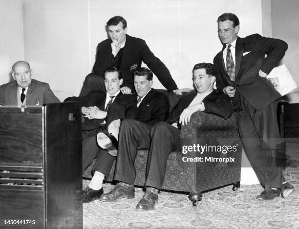 Manchester United players watching the cup draw in their Blackpool hotel. Bill Inglis , Gordon Clayton, Colin Webster, Ron Cope, Fred Goodwin and...