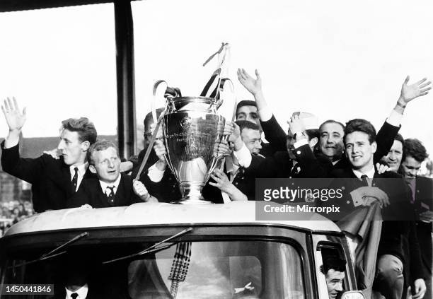 The Celtic football team parade the European Cup trophy from an open top lorry during their victory parade at Celtic Park following their historic...