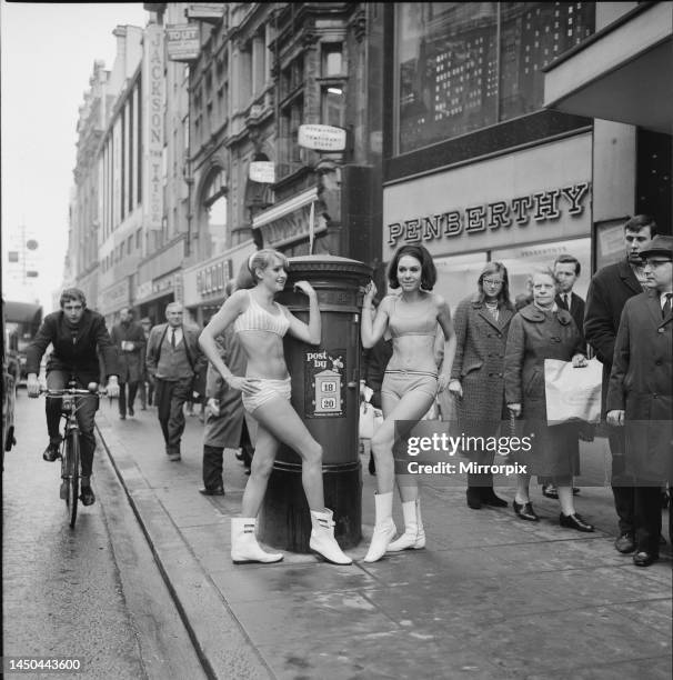 Carole Kirkley and brunette Angela Harvey modelling clothes from Etam in Oxford Street. 16th December 1965.