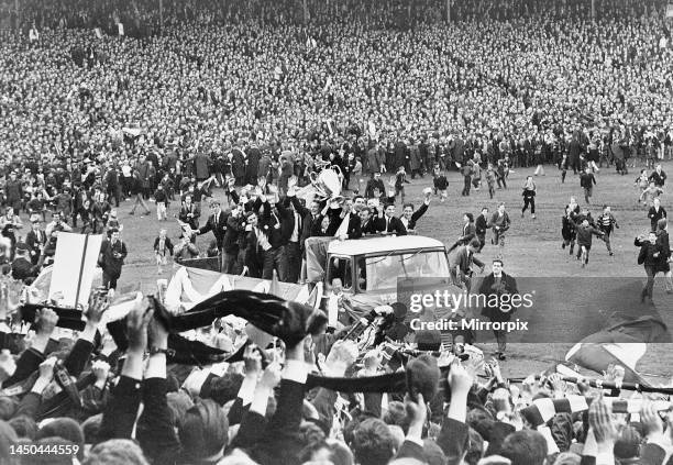 The Celtic football team parade the European Cup trophy from an open top lorry during their victory parade at Celtic Park following their historic...