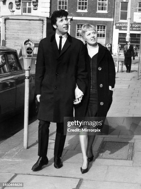 Singer Tom Jones and wife Melinda stroll around Hanover Square in London.