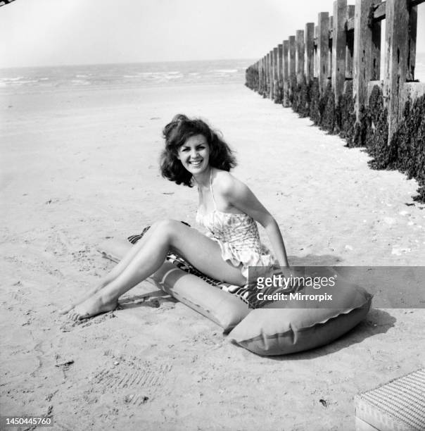 Having holiday fun in the sun at Minnis Bay near Margate, Kent is eighteen year old Beverley Bennett, an actress at the Adia Foster School. June 1960.