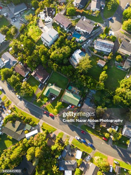 suburb overhead perspective rooftop. - nz house and driveway stock-fotos und bilder