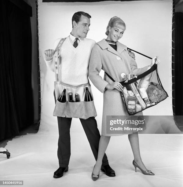 Man and woman wearing matching aprons. 1960.