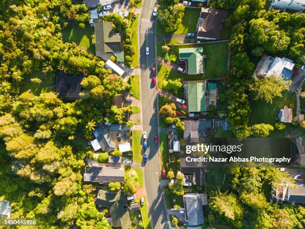 aerial shot of suburban development. - nz house and driveway stock-fotos und bilder