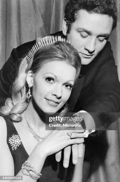 Model girl Ilona wearing a suit of diamond jewellery, tiara, earrings, ring, necklace, brooch and two bracelets, the total cost- £100,000. Listening...