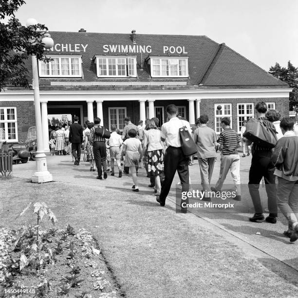 General scenes of the crowds going into Finchley open air swimming pool. London, June 1960.