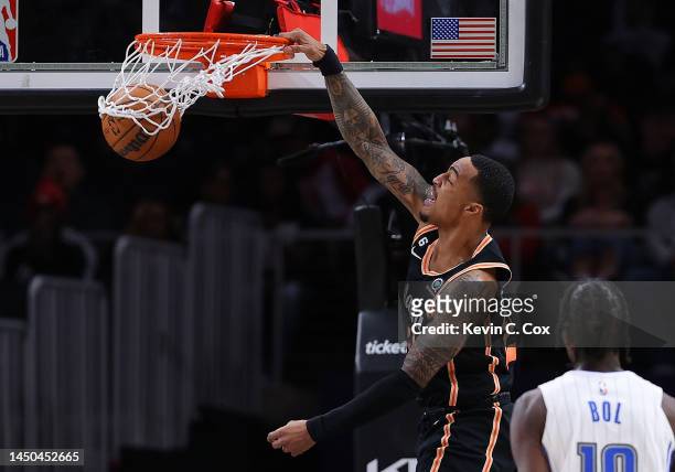 John Collins of the Atlanta Hawks dunks against the Orlando Magic during the second quarter at State Farm Arena on December 19, 2022 in Atlanta,...