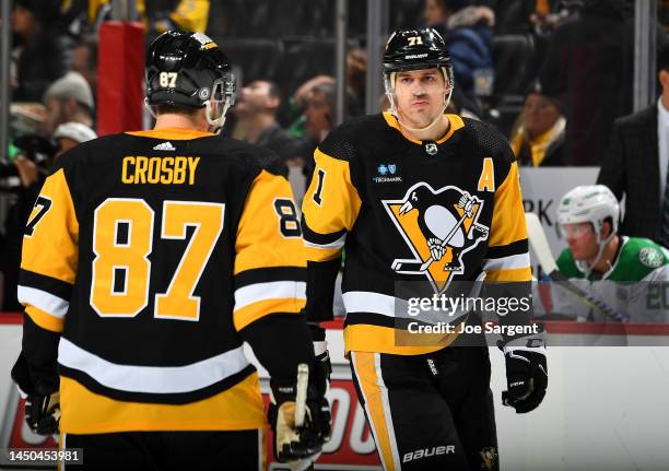 Evgeni Malkin talks with Sidney Crosby of the Pittsburgh Penguins during the game against the Dallas Stars at PPG PAINTS Arena on December 12, 2022...