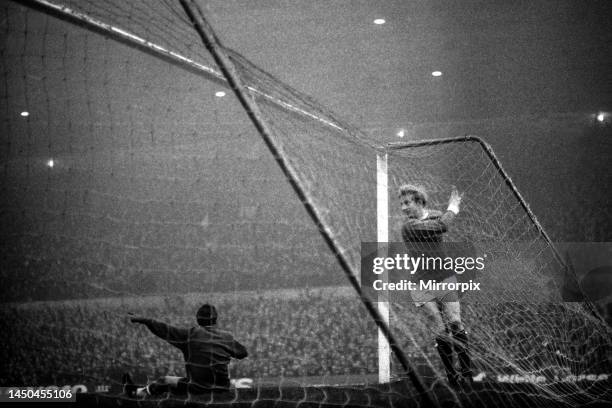 Manchester United forward in the back of the Liverpool goal after scoring the game's only goal past dejected goalkeeper Tommy Lawrence during their...