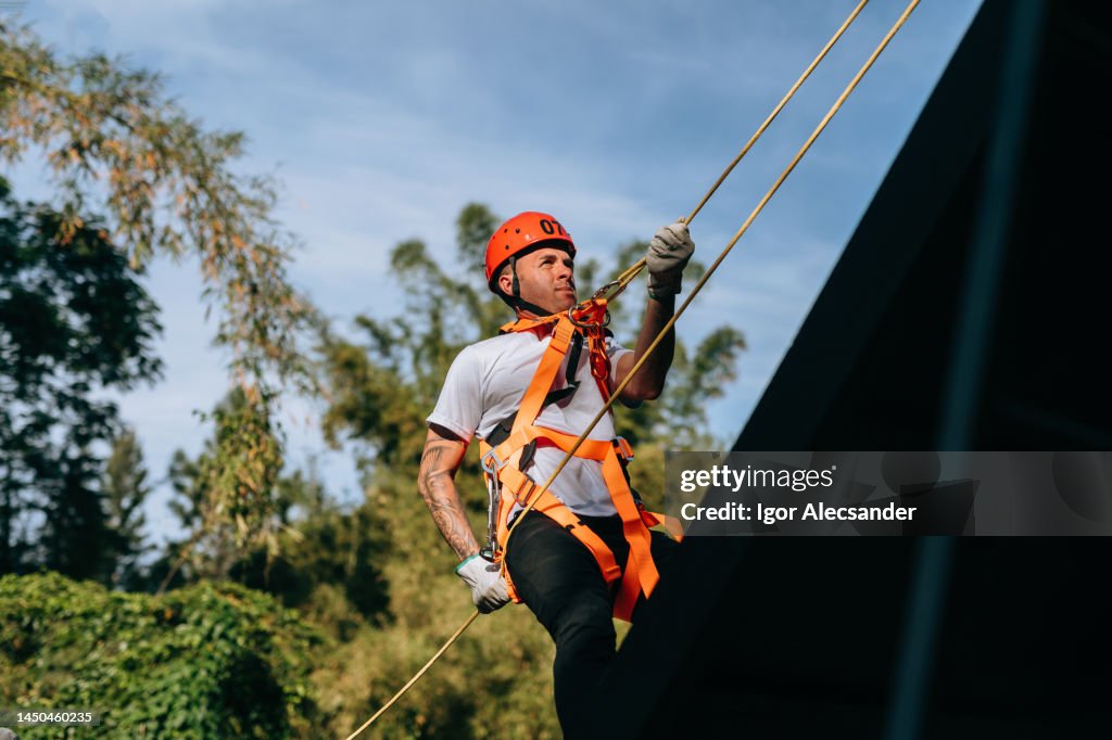 Rescuer climbing a rope ramp