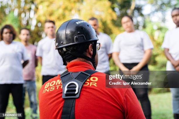 instructor rescuer giving practical class - fireman training stock pictures, royalty-free photos & images