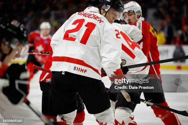 Nathan Gaucher of Team Canada looking back for puck against team Switzerland in the second period during the 2023 IIHF World Junior Championship game...