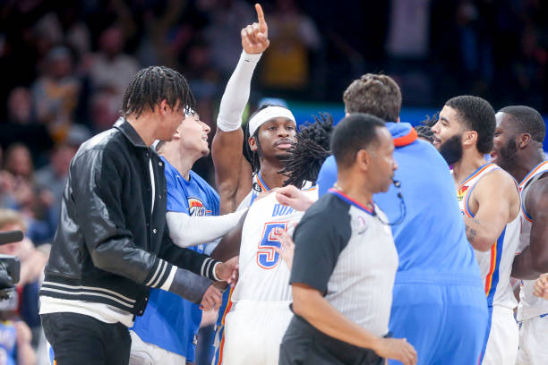 Shai Gilgeous-Alexander of the Oklahoma City Thunder celebrates with teammates after hitting a game winning shot against the Portland Trail Blazers...