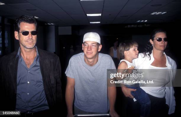 Actor Pierce Brosnan, girlfriend Keely Shaye Smith, son Sean Brosnan and Dylan Brosnan on July 29, 1999 at the Los Angeles International Airport in...