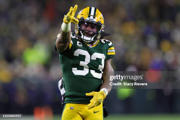 Aaron Jones of the Green Bay Packers reacts after a first down against the Los Angeles Rams at Lambeau Field on December 19, 2022 in Green Bay,...