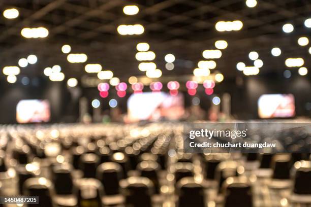 defocused illuminated lights at concert - empty concert stock pictures, royalty-free photos & images
