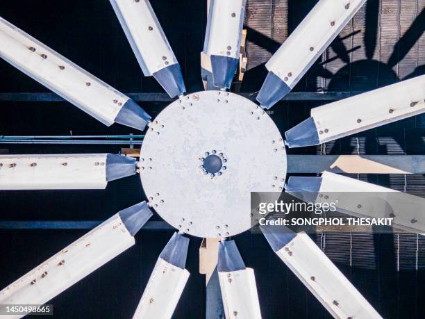 aerial view/a steam turbine is a device or machine that uses high pressure steam to drive a turbine to rotate around a shaft to generate electricity in a power plant. - nuclear energy fotografías e imágenes de stock