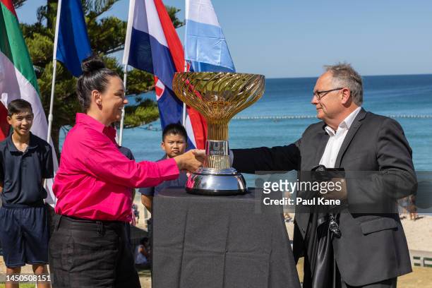 Casey Dellacqua and The Hon. David Templeman unveil the United Cup trophy during a United Cup media opportunity at Cottesloe Beach on December 20,...