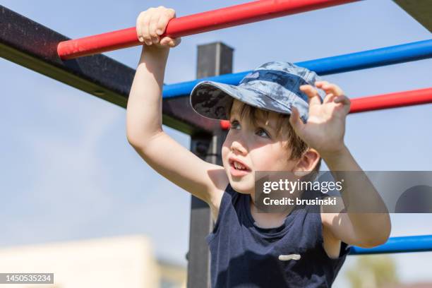 5 year old white boy playing in the playground - 5 year stock pictures, royalty-free photos & images