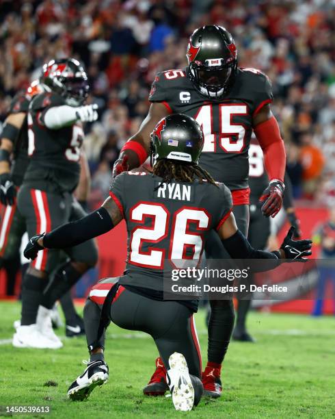 Devin White and Logan Ryan of the Tampa Bay Buccaneers reacts against the Cincinnati Bengals during the third quarter at Raymond James Stadium on...