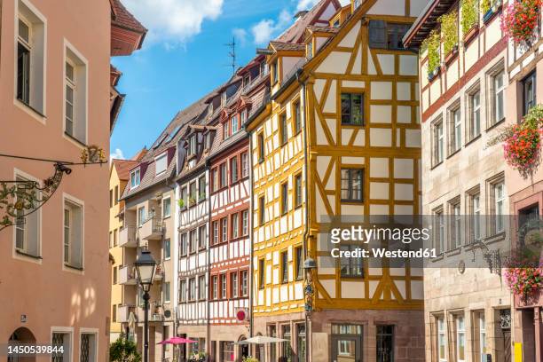 germany, bavaria, nuremberg, historic houses along weissgerbergasse alley - nuremberg stock pictures, royalty-free photos & images