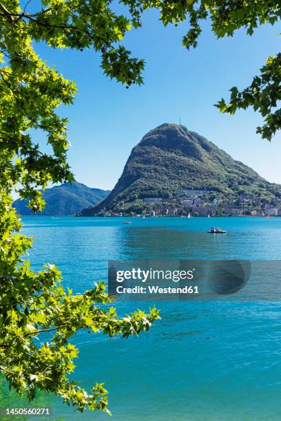 switzerland, ticino canton, lugano, view of lake lugano with monte san salvatore in background - ticino canton 個照片及圖片檔