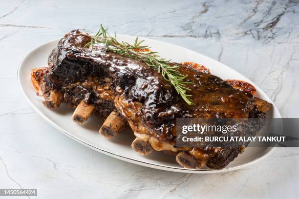 orange glazed ribs - beef ribs stock pictures, royalty-free photos & images