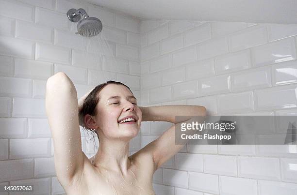 woman enjoying a shower - young women no clothes stock pictures, royalty-free photos & images
