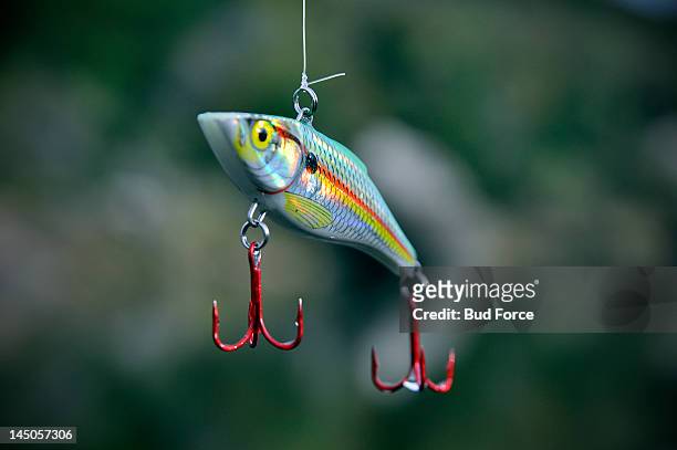 colorful close-up of a fishing lure. - fishing hook stock-fotos und bilder