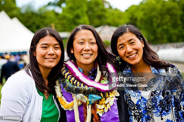 sisters pose for the camera. - hawaiianische kultur stock-fotos und bilder