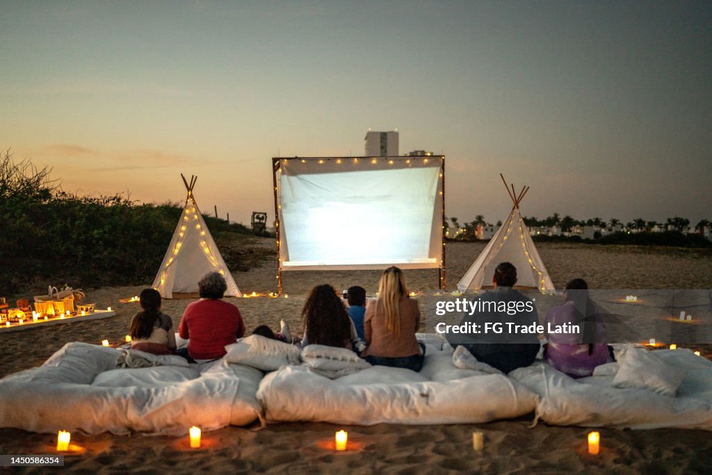 Group of people watching a movie at the outdoors cinema