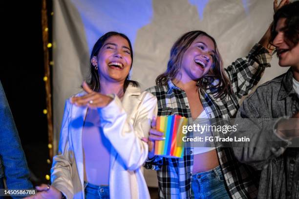 group of young friends dancing at a beach party - venezuelan girls stock pictures, royalty-free photos & images