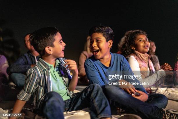 children talking and laughing at the outdoors cinema - artist bildbanksfoton och bilder