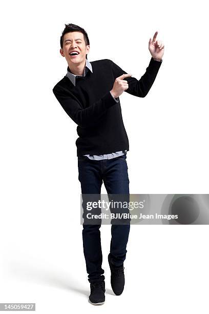 stylish young man dancing - chinese dance stock pictures, royalty-free photos & images